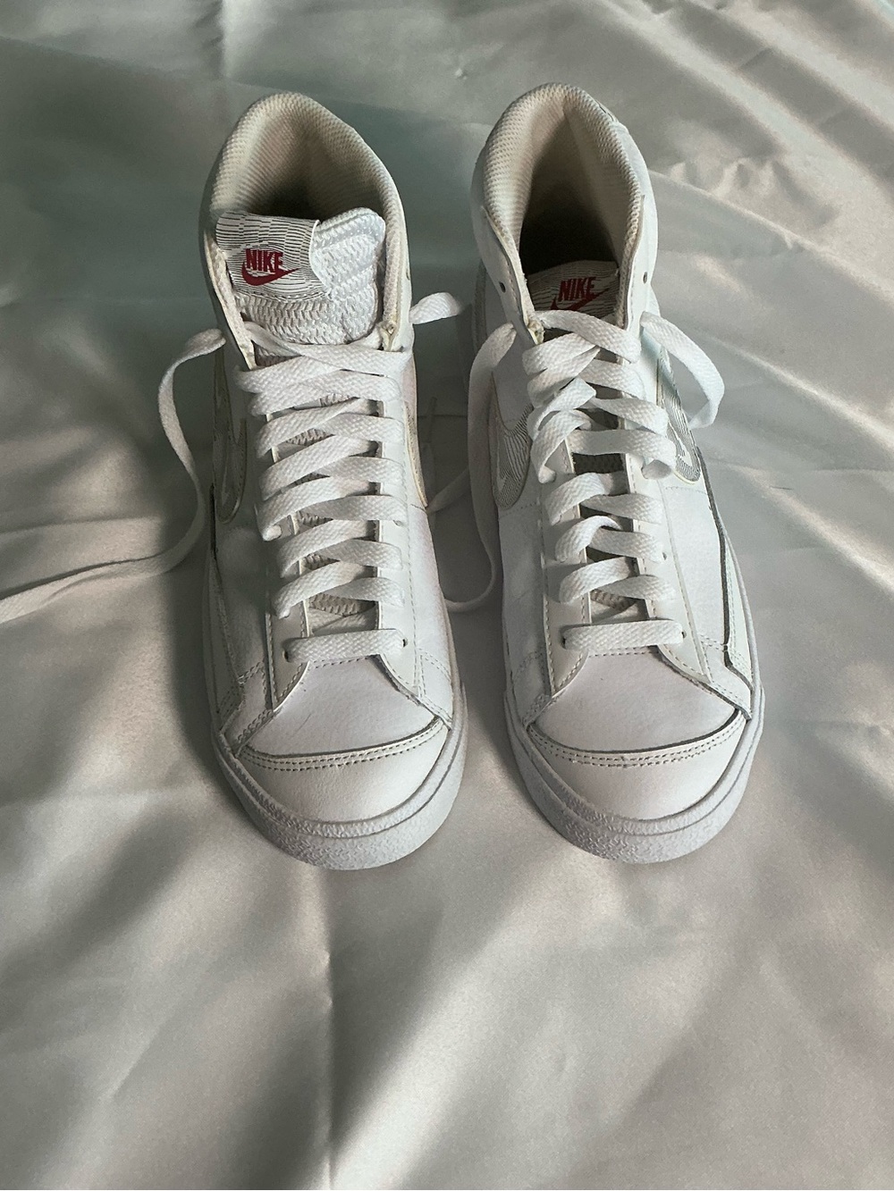 Nike White High-Top Sneakers with Red Logo